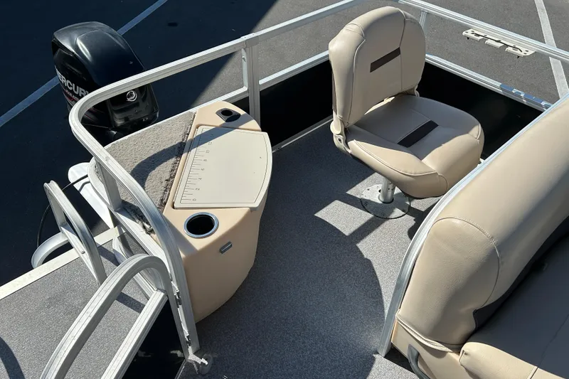 Slide: The Image of 2017 Sun Tracker Bass Buggy 18 DLX interior with seating and fishing station. - 13