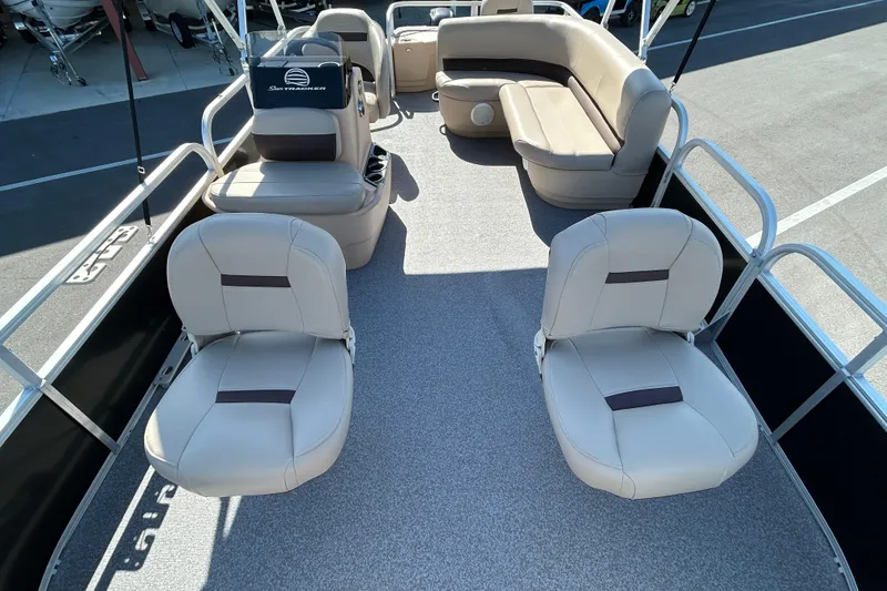 Slide: The Image of 2017 Sun Tracker Bass Buggy 18 DLX pontoon boat interior with seating and helm. - 9
