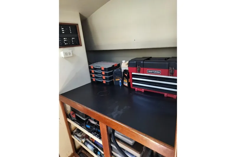 Slide: The Image of Workshop area on a 2003 Custom Leopard Morrelli & Melvin 46 with toolboxes and storage shelves. - 11