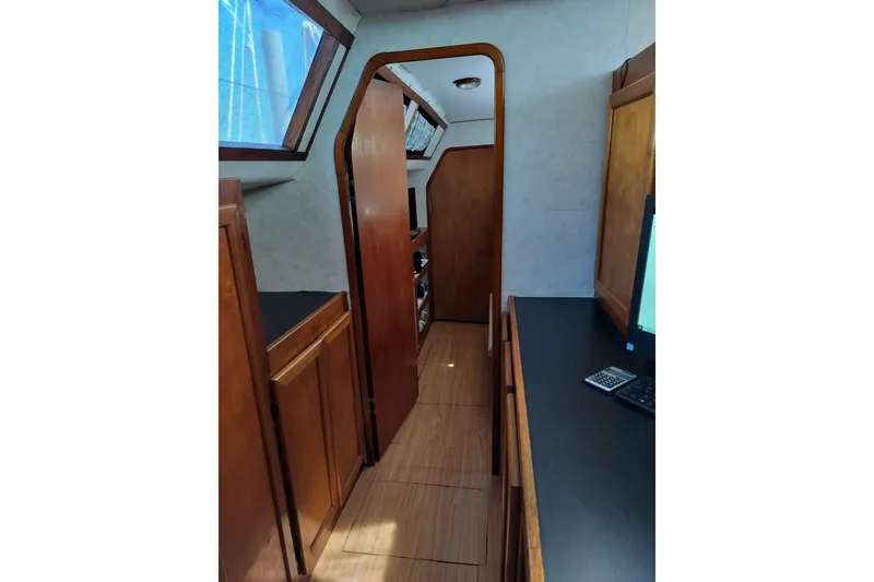 Slide: The Image of Interior of 2003 Custom Leopard Morrelli & Melvin 46 yacht with wooden cabinetry and windows. - 12
