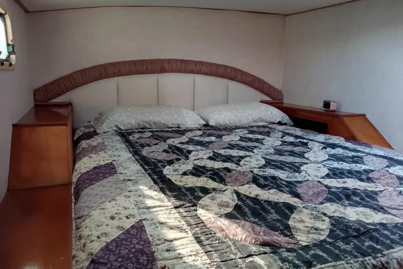 Slide: The Image of Cozy bedroom interior of 2003 Custom Leopard Morrelli & Melvin 46 yacht with patterned bedding. - 24
