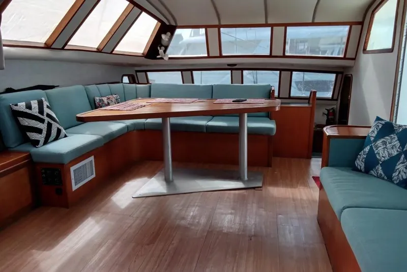 Slide: The Image of Spacious interior of 2003 Custom Leopard Morrelli & Melvin 46 yacht with elegant seating and table. - 28