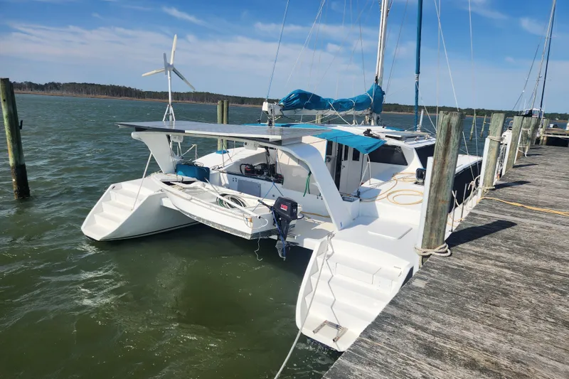 Slide: The Image of 2003 Custom Leopard Morrelli & Melvin 46 catamaran docked at a marina. - 7
