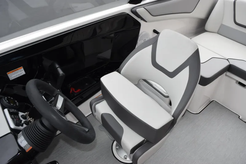 Slide: The Image of 2026 Yamaha Boats AR220 interior with modern steering and comfortable seating. - 10