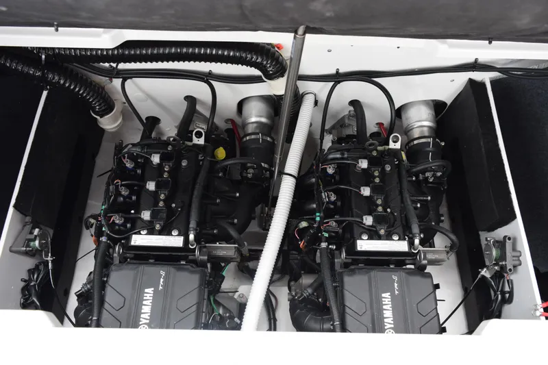Slide: The Image of 2026 Yamaha Boats AR220 engine compartment showcasing dual engines and intricate wiring. - 22