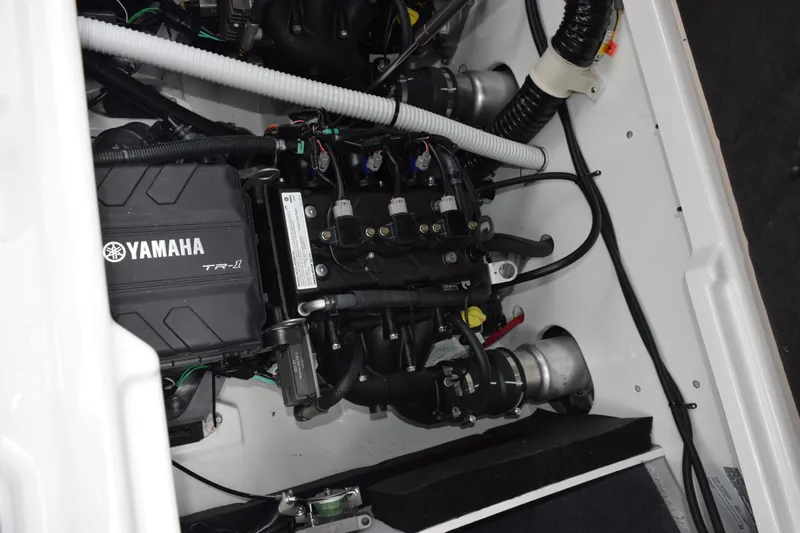 Slide: The Image of Engine compartment of 2026 Yamaha Boats AR220, featuring Yamaha TR-1 engine components. - 23