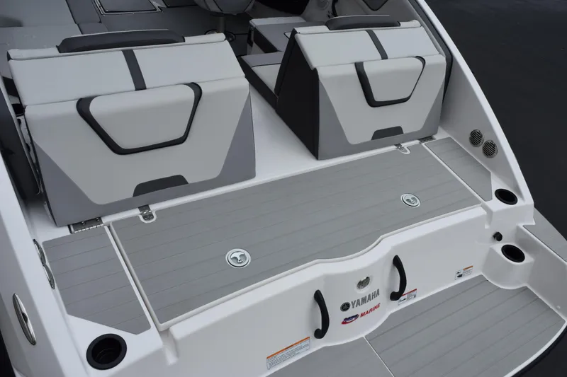 Slide: The Image of 2026 Yamaha Boats AR220 swim platform with sleek seating and modern design. - 8