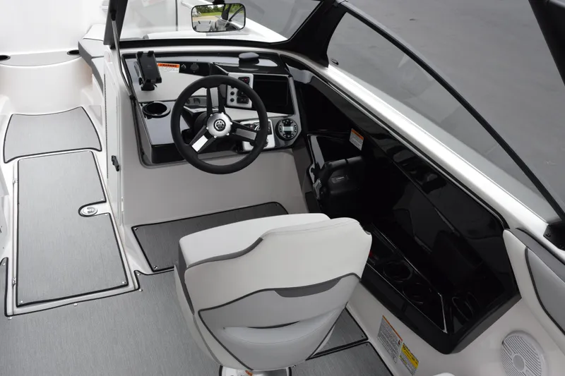 Slide: The Image of 2026 Yamaha Boats AR220 cockpit with modern steering and control panel. - 9