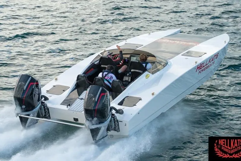 Slide: The Image of 2025 HellCat 32 Widebody powerboat speeding on water, showcasing dual engines and sleek design. - 11