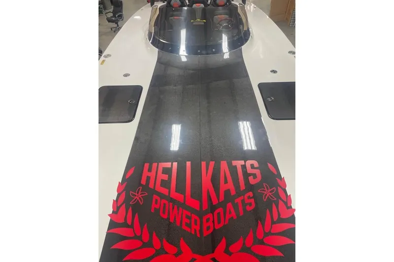 Slide: The Image of 2025 HellCat 32 Widebody powerboat with bold red branding on deck. - 4