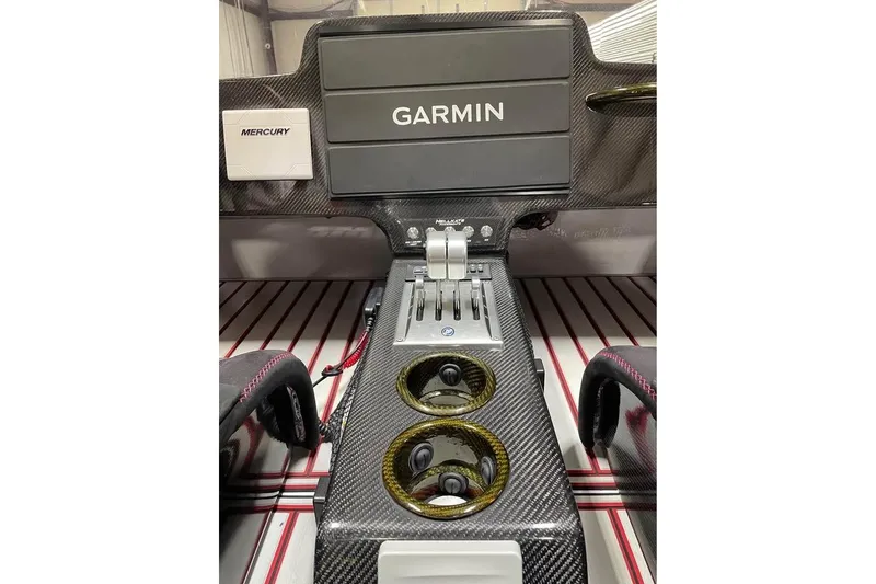 Slide: The Image of Interior of 2025 HellCat 32 Widebody with Garmin navigation and Mercury controls. - 7