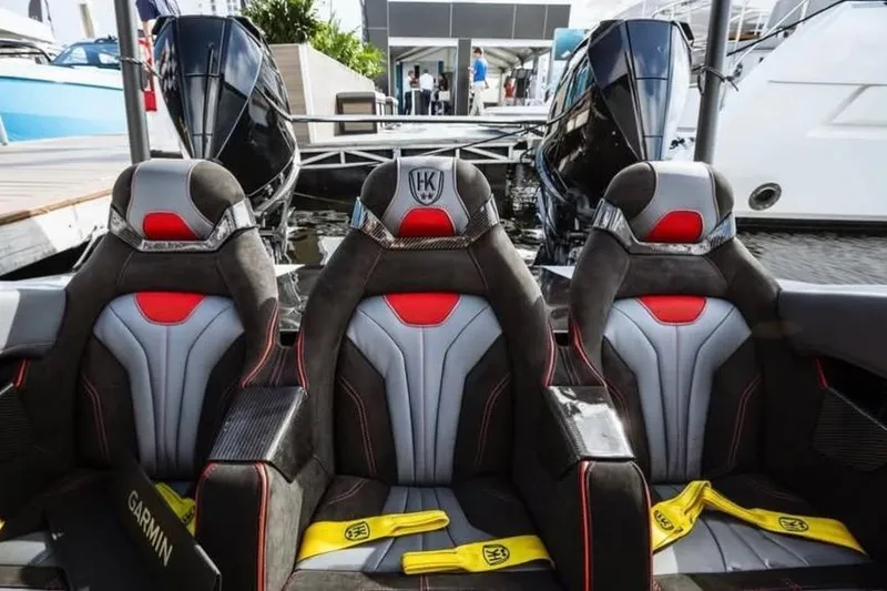 Slide: The Image of 2025 HellCat 32 Widebody boat interior with sporty seats and dual engines. - 8