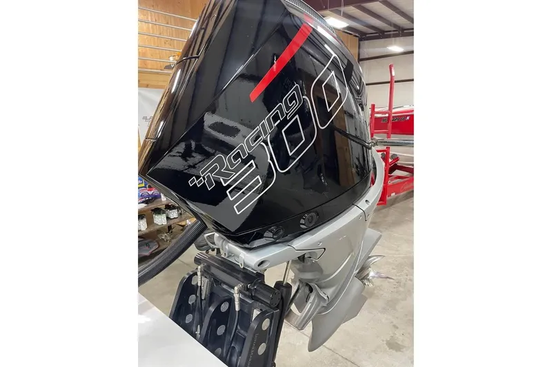 Slide: The Image of 2025 HellCat 32 Widebody Racing 300 outboard engine in a workshop setting. - 9