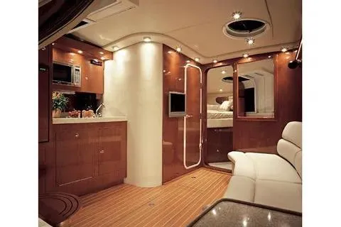 Slide: The Image of Luxurious interior of 2005 Regal Commodore 3560 IO yacht with wood finishes and modern amenities. - 11