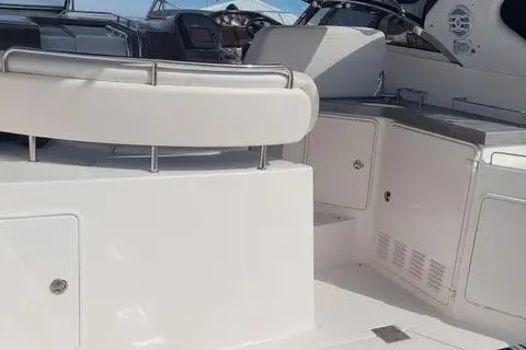 Slide: The Image of 2005 Regal Commodore 3560 IO yacht interior with seating and control panel. - 12