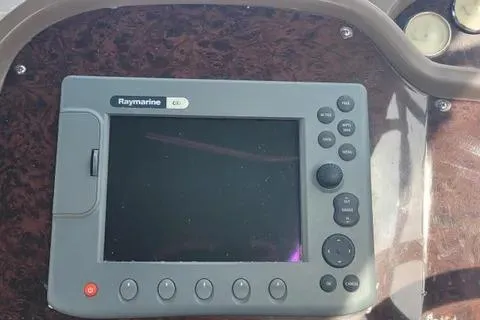 Slide: The Image of Raymarine GPS system on 2005 Regal Commodore 3560 IO boat dashboard. - 13