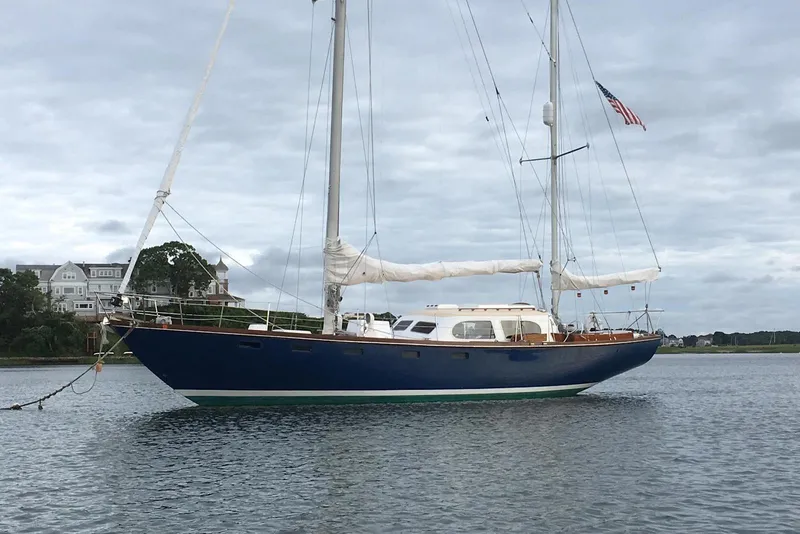 Slide: The Image of Sailing yacht Pearson Countess 44, 1965, anchored on calm water with cloudy sky. - 11