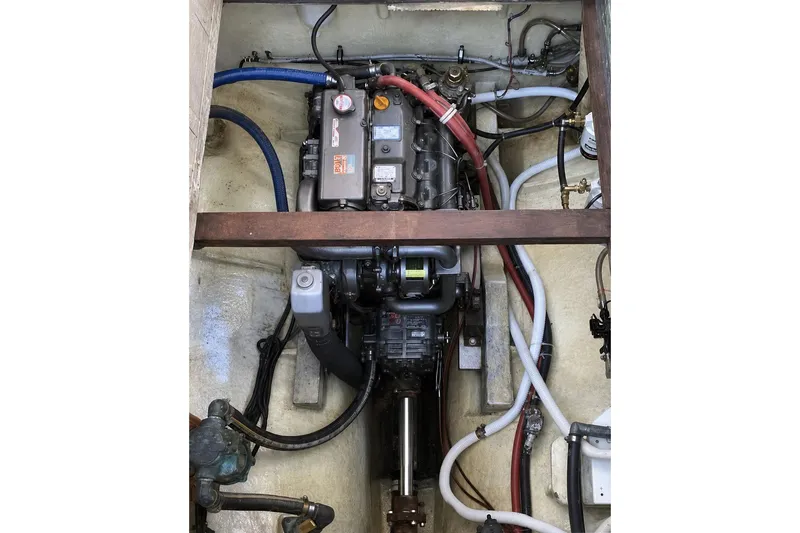 Slide: The Image of Engine compartment of a 1965 Pearson Countess 44 sailboat, showing detailed mechanical components. - 14