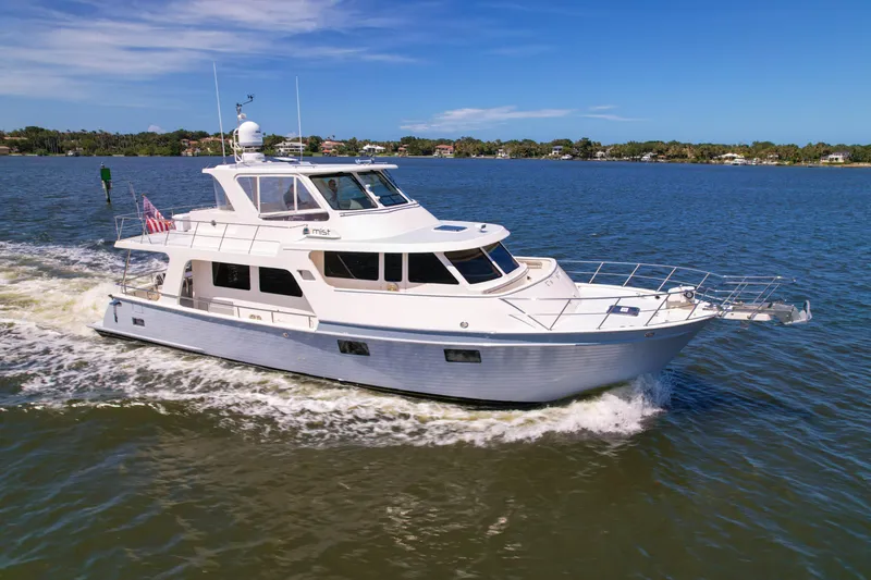 The Image of 2018 Marlow 53E yacht cruising on a sunny day in calm waters. - 0