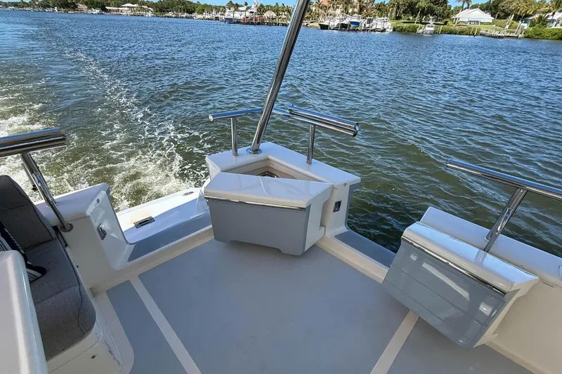 Slide: The Image of Stern view of 2018 Marlow 53E yacht cruising on a scenic waterway. - 11