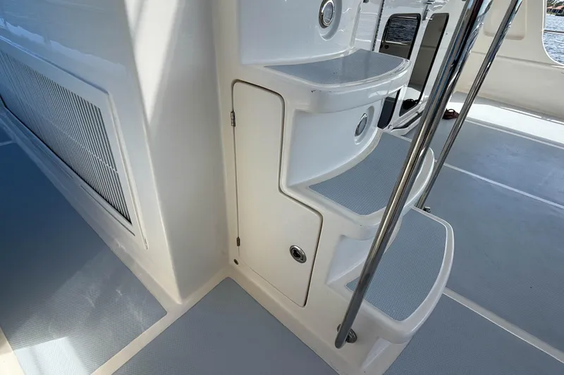 Slide: The Image of Staircase on 2018 Marlow 53E yacht with sleek design and stainless steel railings. - 12