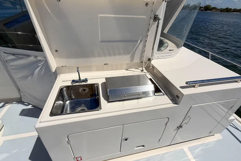 Slide: The Image of Outdoor kitchen on 2018 Marlow 53E yacht with sink and grill. - 18