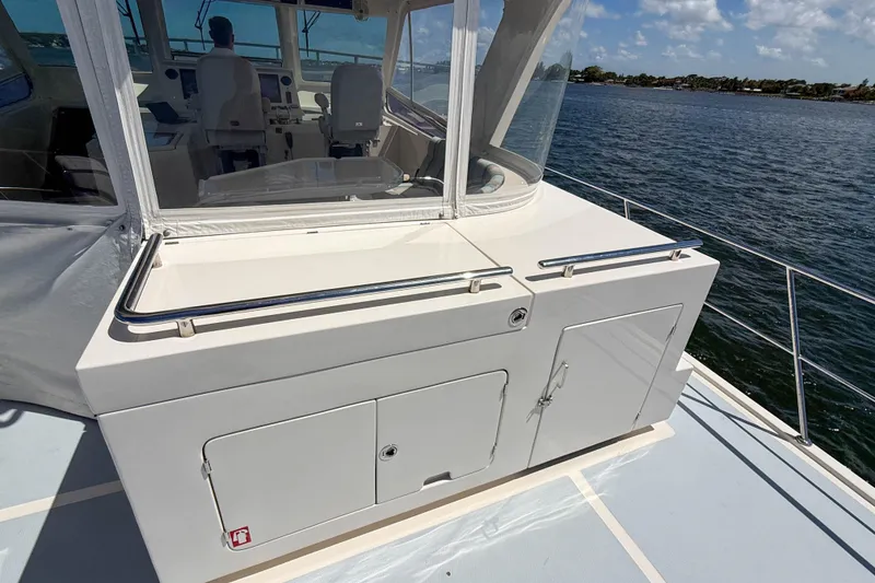 Slide: The Image of 2018 Marlow 53E yacht deck with helm station and ocean view. - 19
