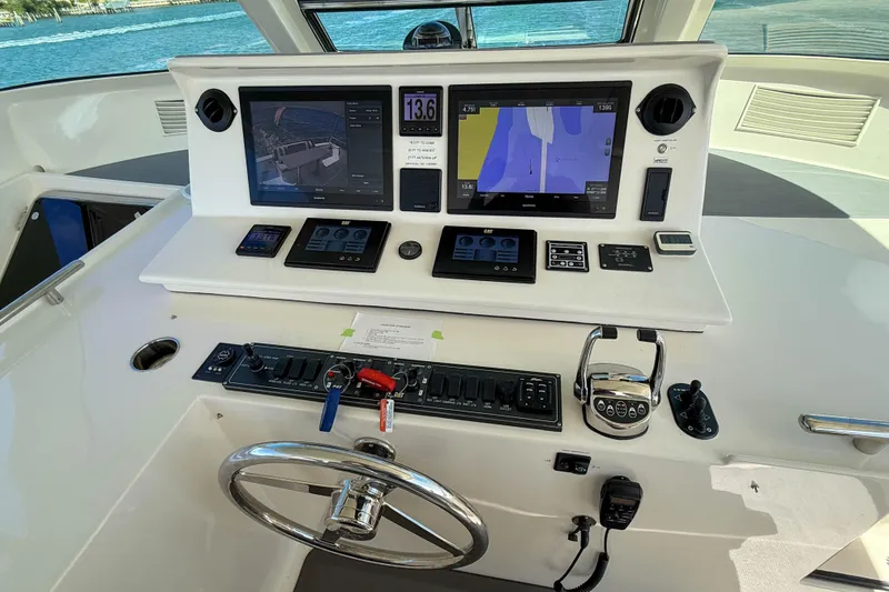 Slide: The Image of Cockpit of 2018 Marlow 53E yacht with advanced navigation and control systems. - 23