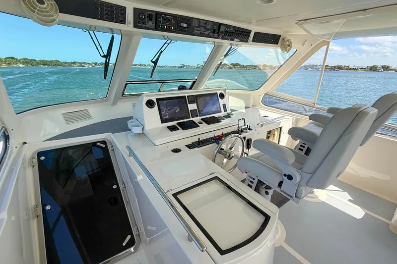 Slide: The Image of Luxurious helm of 2018 Marlow 53E yacht with advanced navigation systems and ocean view. - 24