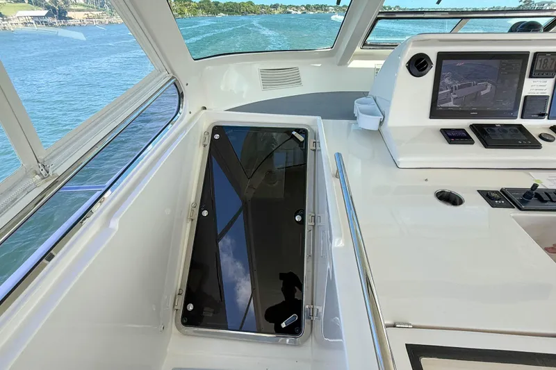 Slide: The Image of Cockpit view of 2018 Marlow 53E yacht with navigation equipment and scenic waterway. - 25