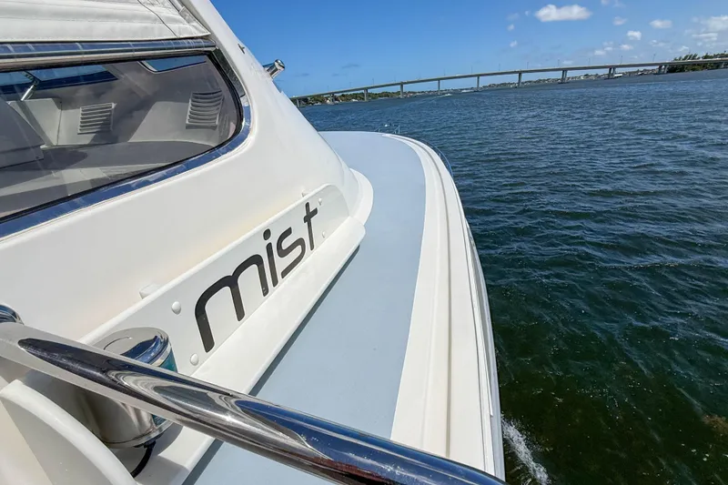 Slide: The Image of 2018 Marlow 53E yacht "Mist" cruising on a sunny day near a bridge. - 32