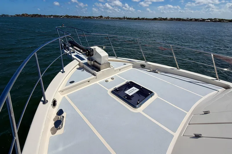Slide: The Image of Bow view of 2018 Marlow 53E yacht on open water under blue sky. - 37