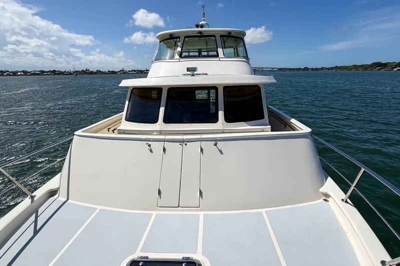 Slide: The Image of 2018 Marlow 53E yacht on open water under clear blue sky. - 38