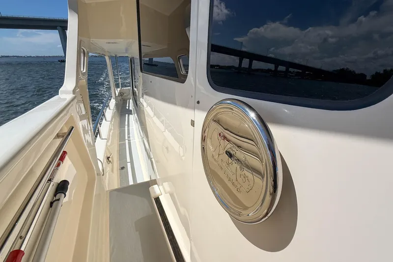 Slide: The Image of Side view of 2018 Marlow 53E yacht with polished details and scenic water backdrop. - 42