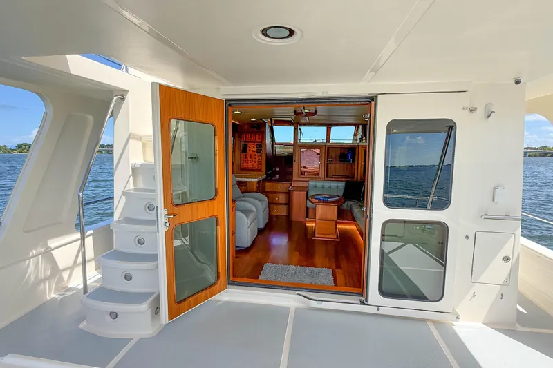 Slide: The Image of Luxurious 2018 Marlow 53E yacht interior with elegant wood finishes and scenic ocean view. - 43