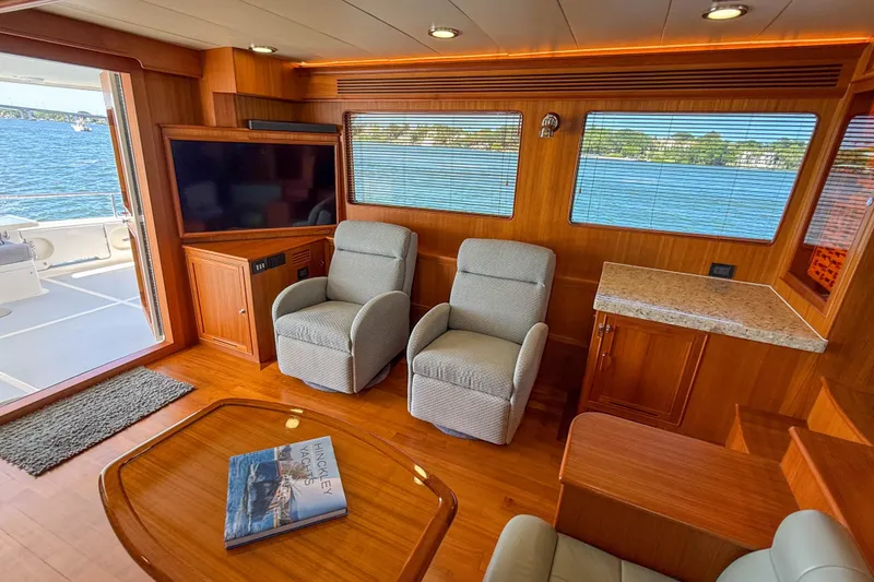 Slide: The Image of Luxurious 2018 Marlow 53E yacht interior with recliners, TV, and scenic water views. - 47