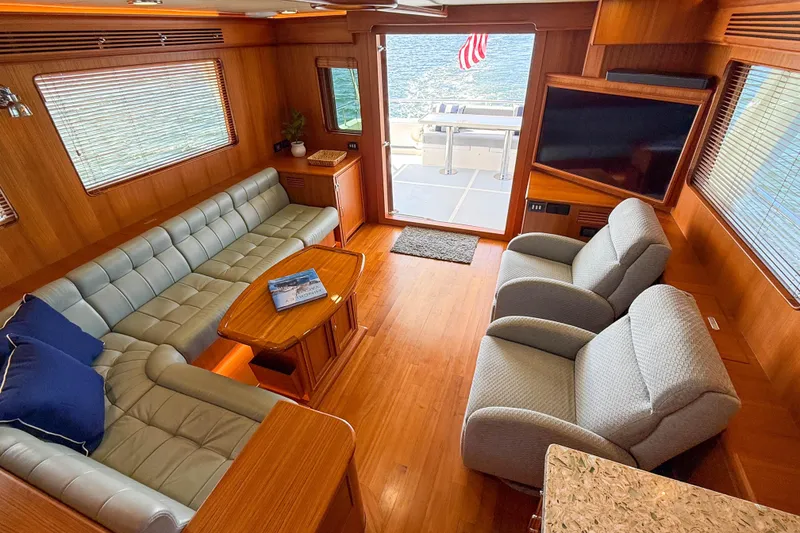 Slide: The Image of Luxurious interior of 2018 Marlow 53E yacht with plush seating and elegant wood finishes. - 49