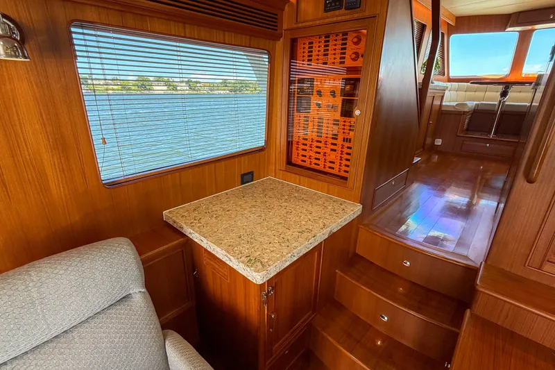 Slide: The Image of Interior of 2018 Marlow 53E yacht with wood paneling and granite countertop. - 51
