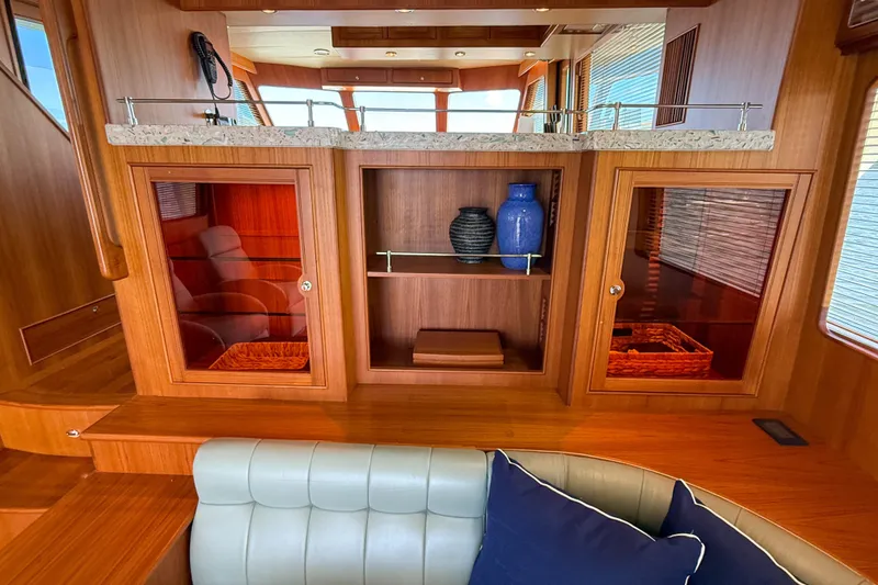 Slide: The Image of Luxurious interior of 2018 Marlow 53E yacht with elegant wood cabinetry and decorative vases. - 52