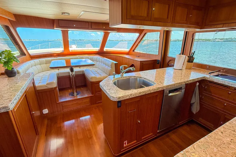 Slide: The Image of Luxurious 2018 Marlow 53E yacht interior with elegant wood finishes and panoramic ocean views. - 53