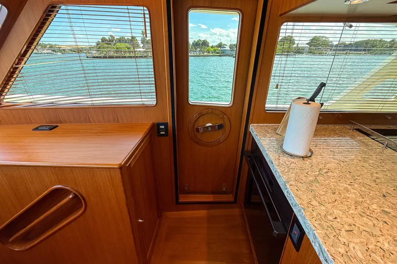 Slide: The Image of Interior of 2018 Marlow 53E yacht with wood finish and water view. - 56