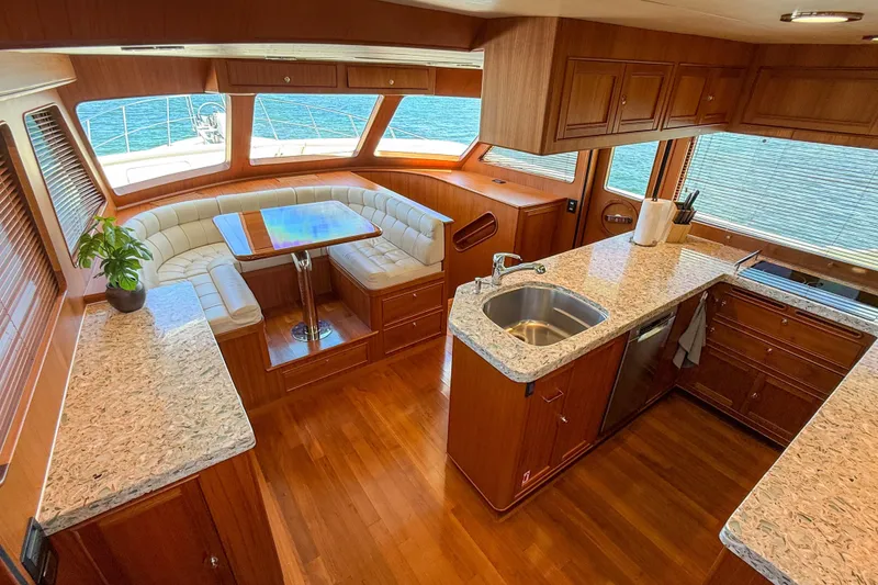 Slide: The Image of Luxurious 2018 Marlow 53E yacht interior with elegant wood finishes and modern kitchen amenities. - 61