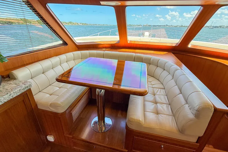 Slide: The Image of Luxurious interior of 2018 Marlow 53E yacht with plush seating and panoramic windows. - 62