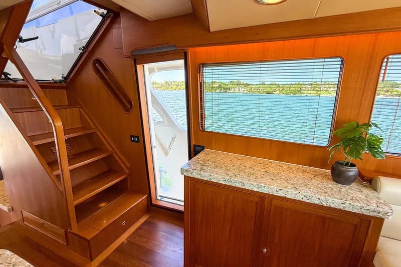 Slide: The Image of Luxurious interior of 2018 Marlow 53E yacht with wooden stairs and scenic window view. - 66