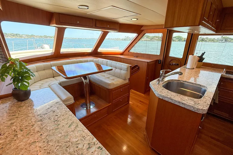Slide: The Image of Luxurious 2018 Marlow 53E yacht interior with elegant dining area and modern kitchen. - 67