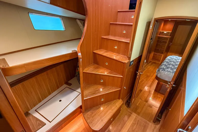 Slide: The Image of Luxurious interior of 2018 Marlow 53E yacht with wooden stairs and cozy cabin. - 68