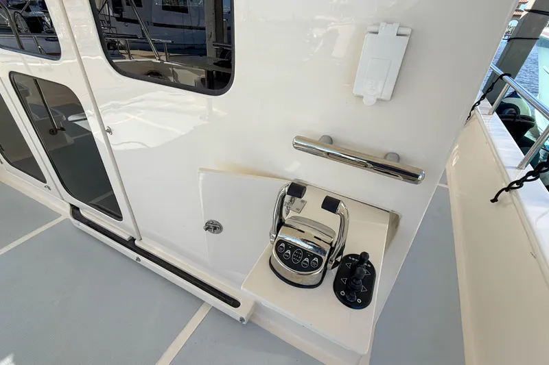 Slide: The Image of Control panel on 2018 Marlow 53E yacht deck, featuring throttle and joystick controls. - 7