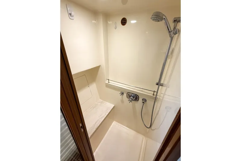 Slide: The Image of Shower area in 2018 Marlow 53E yacht, featuring modern fixtures and a sleek design. - 75