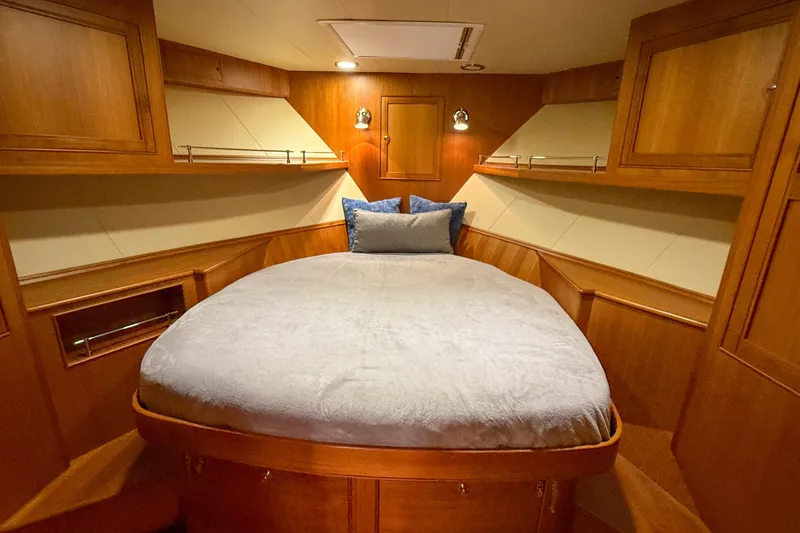 Slide: The Image of Luxurious cabin interior of 2018 Marlow 53E yacht with cozy bed and wooden finish. - 76