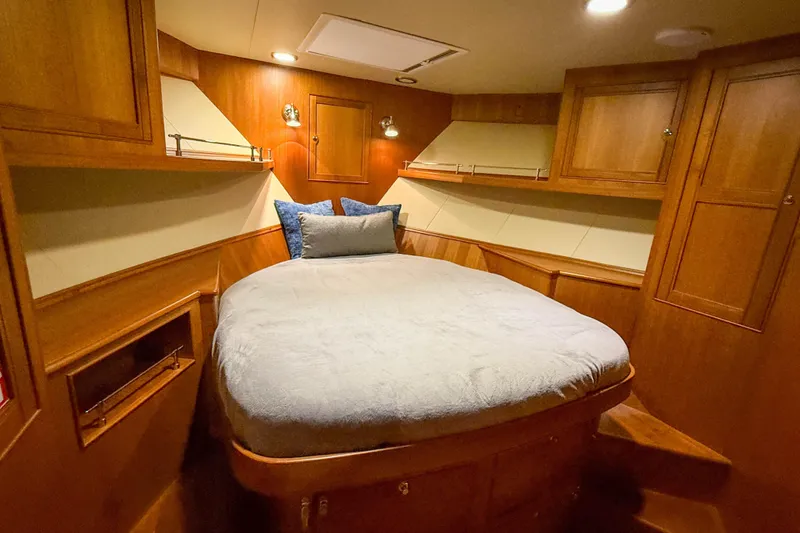 Slide: The Image of Luxurious cabin interior of 2018 Marlow 53E yacht with cozy bed and wooden finish. - 77